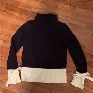 Sweater with wrist bow detail